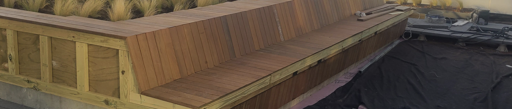 New Hotel Construction Financing Wooden Bench At A Rooftop